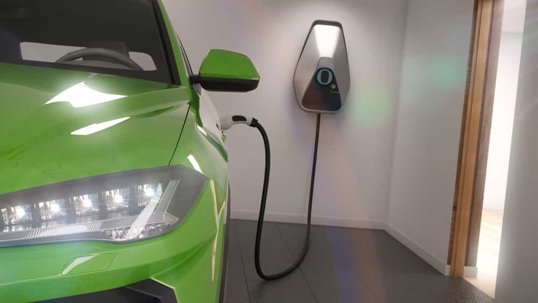 electric car plugged into EV charger